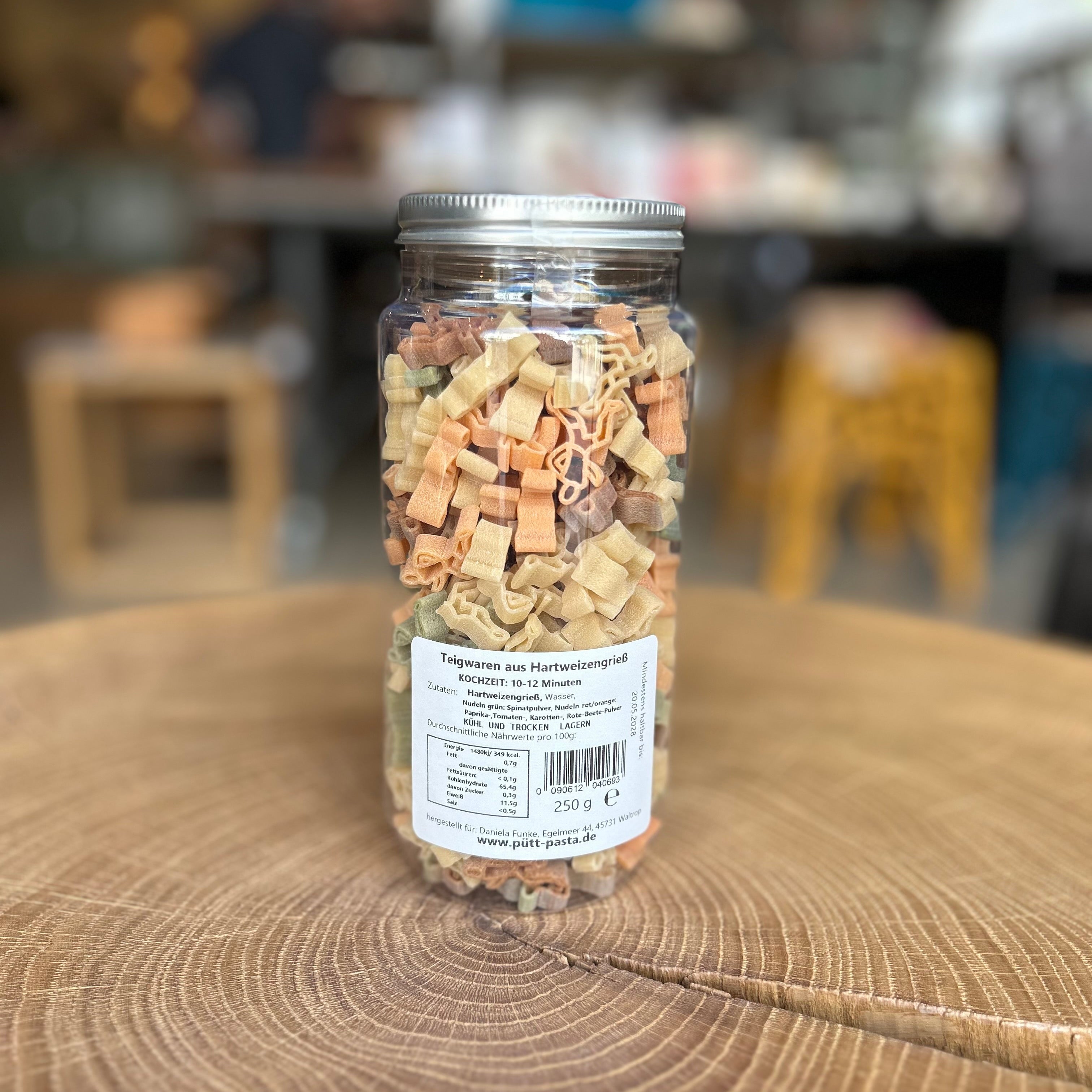 Bunte Läufer Pasta in Läuferform im Glas – originelle Motivnudeln für Läufer und Laufbegeisterte, besondere Geschenkidee und Feinkost bei MANUFAKT.RUHR.